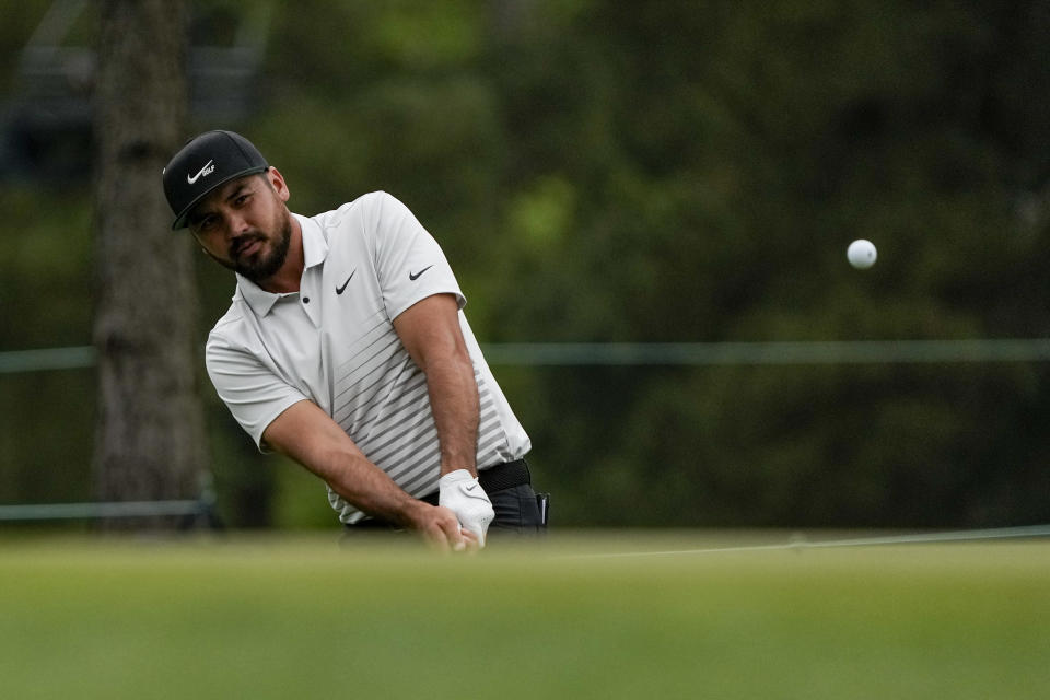 Jason Day, of Australia, chips to the green on the 17th hole during the second round of the Masters golf tournament on Friday, April 9, 2021, in Augusta, Ga. (AP Photo/Gregory Bull)