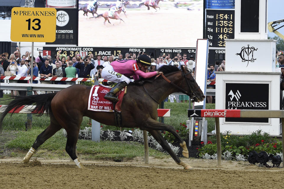 War of Will, ridden by Tyler Gaffalione, crosses the finish line first to win the Preakness Stakes horse race at Pimlico Race Course, Saturday, May 18, 2019, in Baltimore. (AP Photo/Mike Stewart)