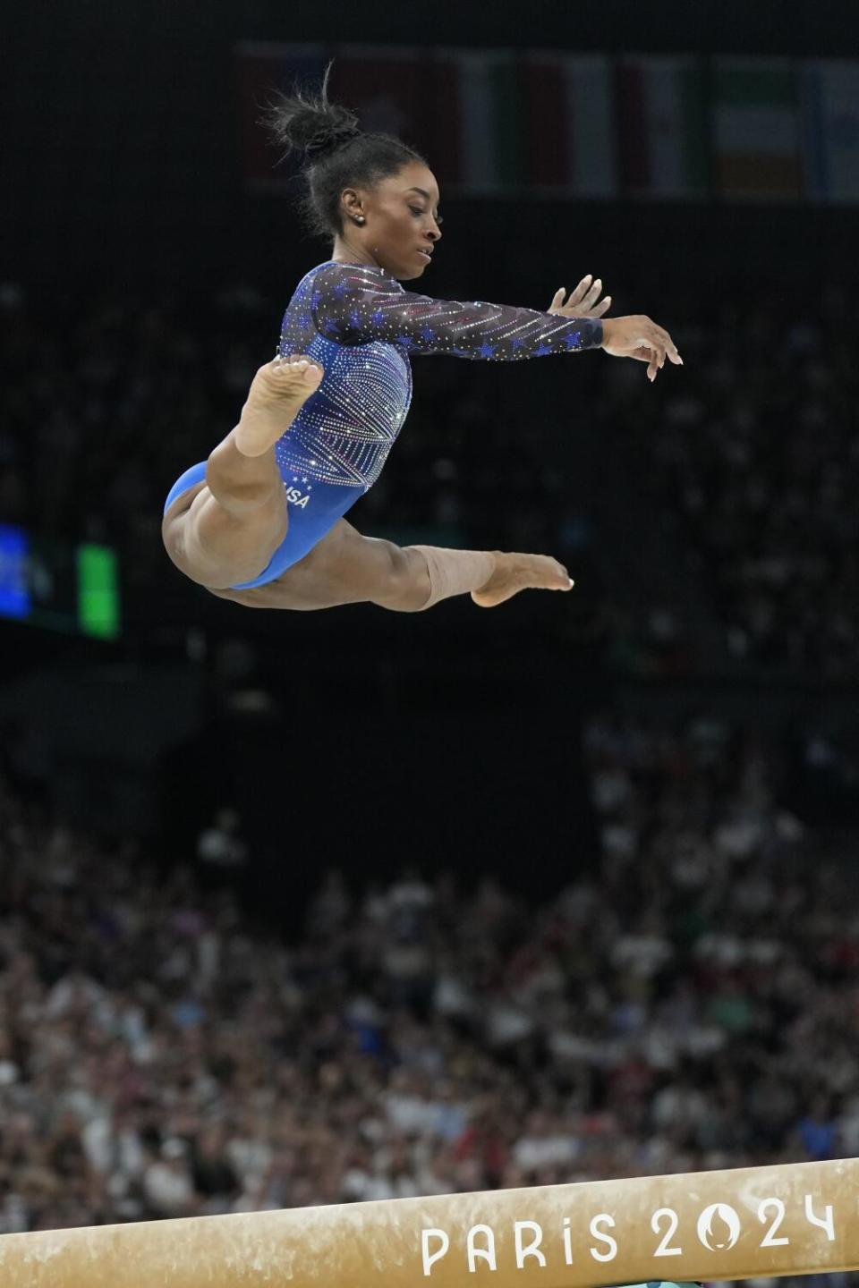 Simone Biles performs on the balance beam during the gymnastics individual all-around finals at the Paris Olympics