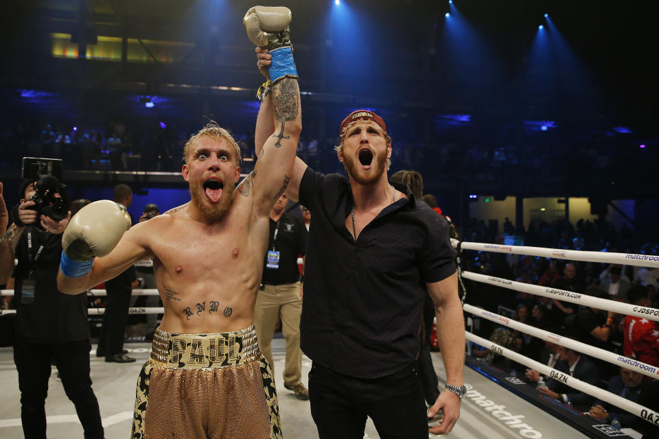 Jake Paul (pictured left) celebrates with his brother, Logan (pictured right), after defeating AnEsonGib in a first round knockout during their fight at Meridian at Island Gardens on January 30, 2020 in Miami, Florida.