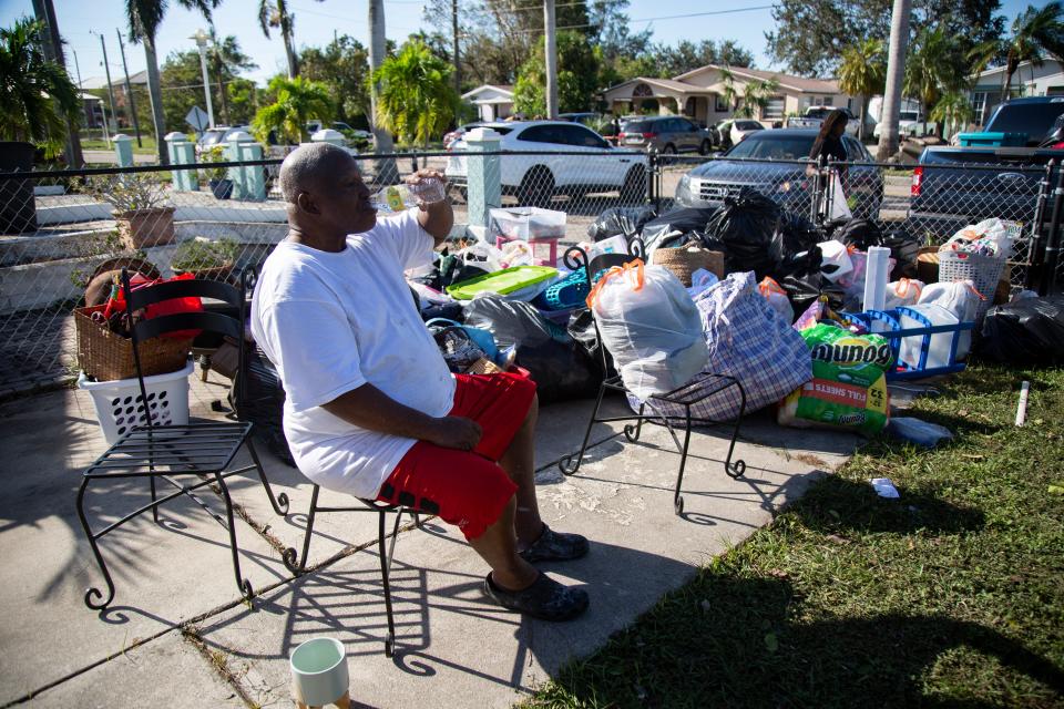 Curtis Williams sits in his front yard on Thursday, Sept. 29, 2022, with all of his possessions after Hurricane Ian caused widespread flooding in the River Park East neighborhood. 