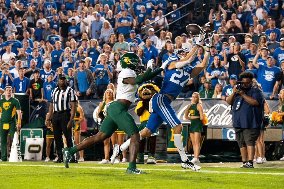 Brigham Young wide receiver Chase Roberts (27) catches a pass for a touchdown against Baylor cornerback Lorando Johnson (11) in the second quarter at LaVell Edwards Stadium.