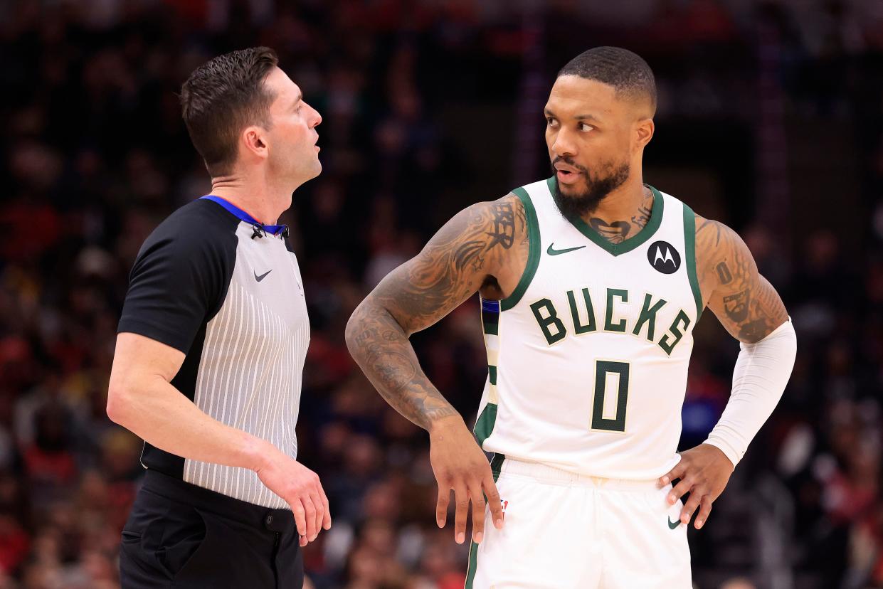 Damian Lillard of the Milwaukee Bucks speaks with referee Ben Taylor during the first half in the game against the Chicago Bulls at the United Center on Thursday night.