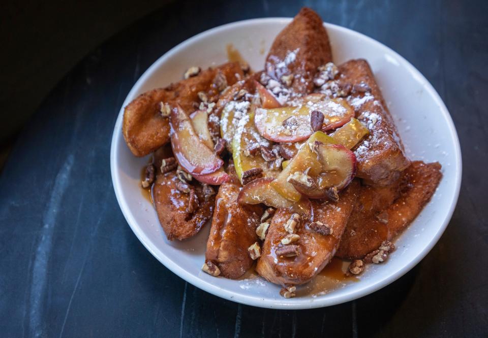 The French toast sticks from the Petty Cash brunch menu sit on a table inside the restaurant in Detroit on Feb. 4, 2023.