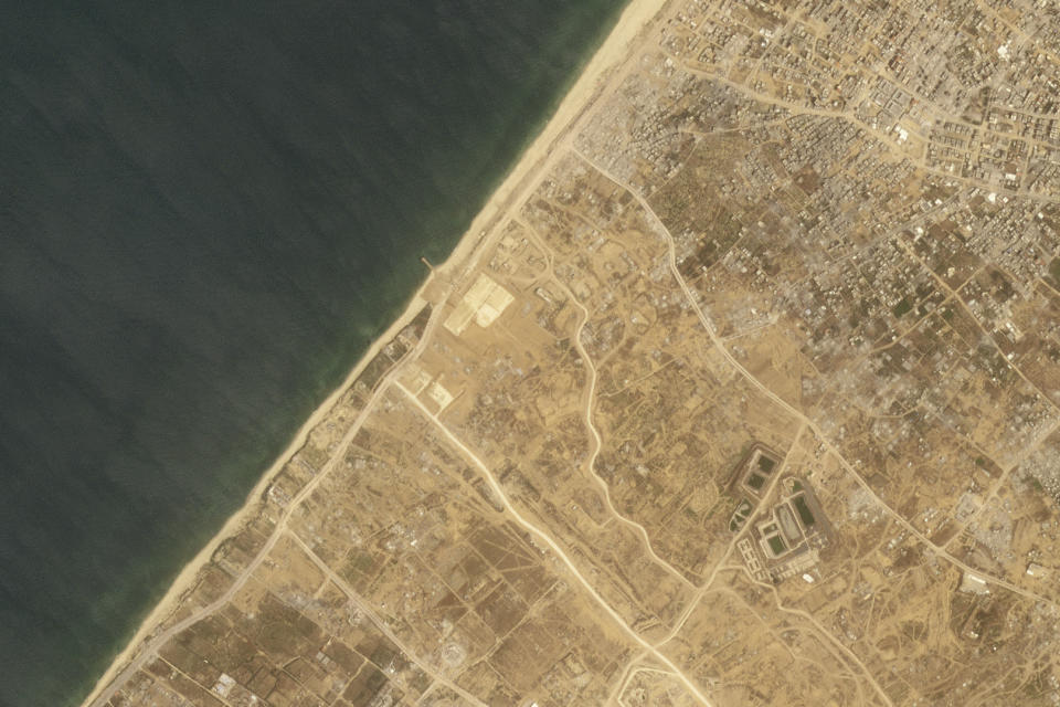 This satellite picture taken by Planet Labs PBC show the construction of a new aid port near Gaza City, Gaza Strip, on Wednesday, April 24, 2024. A new port is being built in the Gaza Strip ahead of a U.S. military-led operation to surge needed food and other aid into the besieged enclave as Israel's war on Hamas there grinds on, according to satellite images analyzed by Thursday, April 25, 2024, by The Associated Press. (Planet Labs PBC via AP)