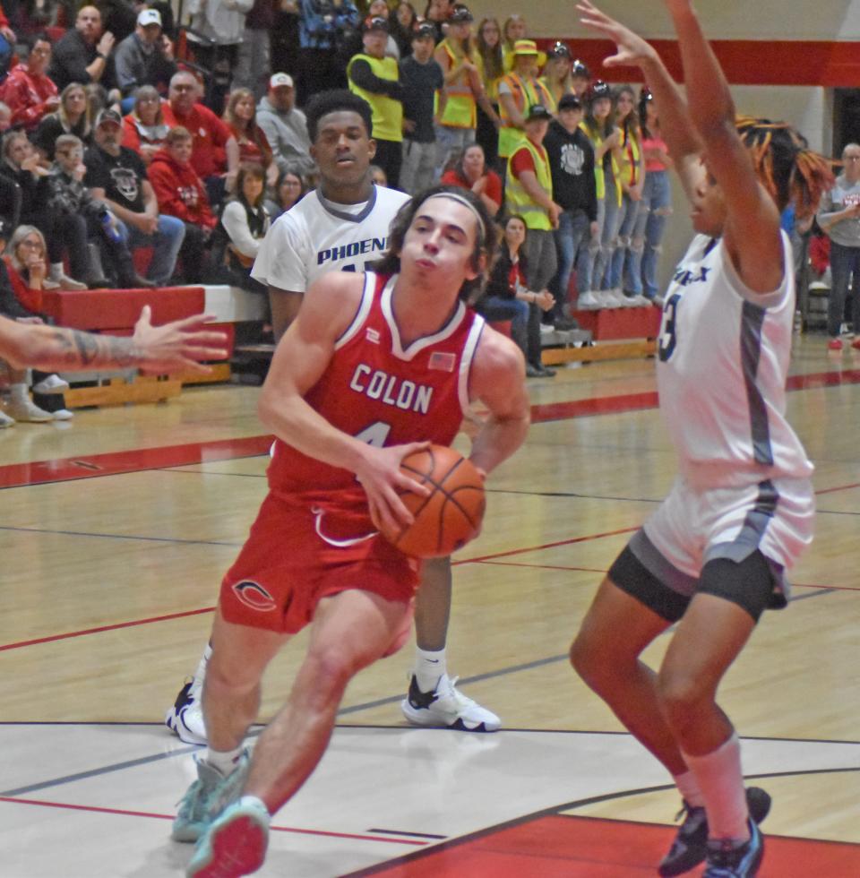 Colon senior Justin Wickey (4) drives in for a tough two points in the D4 Regional Finals on Wednesday. Wickey scored his 1000th career point in the tough loss.
