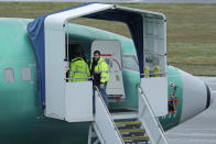 Workers enter a Boeing 737 Max airplane being built for Aeromexico, Wednesday, Dec. 11, 2019, at Renton Municipal Airport in Renton, Wash. The chairman of the House Transportation Committee said Wednesday that an FAA analysis of the 737 Max performed after a fatal crash in 2018 predicted "as many as 15 future fatal crashes within the life of the fleet." (AP Photo/Ted S. Warren)