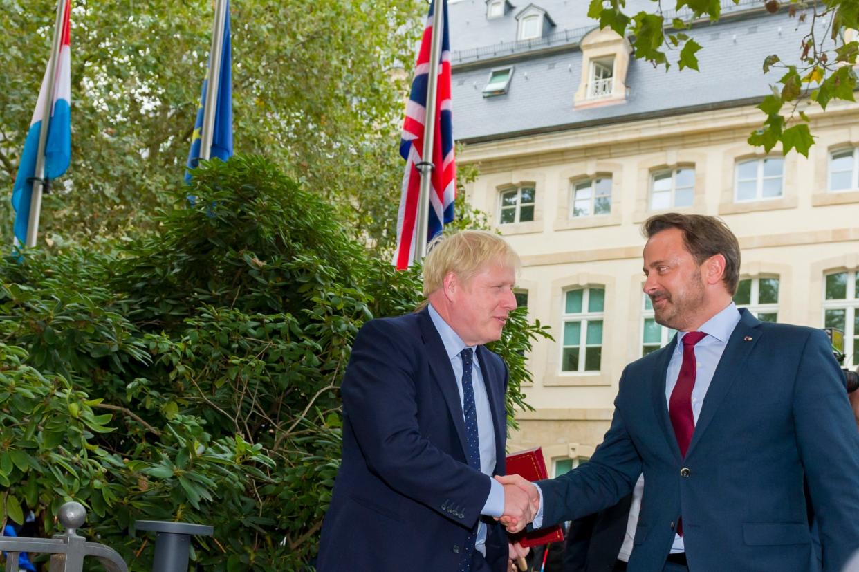 Boris Johnson and Xavier Bettel shake hands before their meeting in Luxembourg: PA