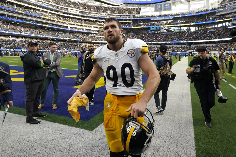 Pittsburgh Steelers linebacker T.J. Watt gets ready to throw his gloves and a towel to fans after the Steelers defeated the Los Angeles Rams 24-17 in an NFL football game Sunday, Oct. 22, 2023, in Inglewood, Calif. (AP Photo/Gregory Bull)