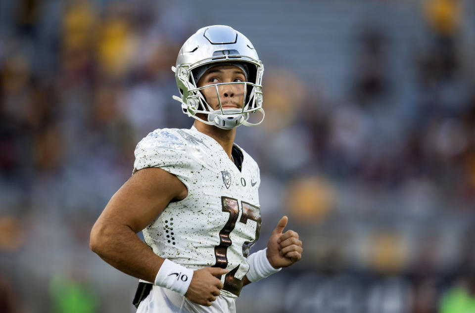 Nov 18, 2023; Tempe, Arizona, USA; Oregon Ducks quarterback Ty Thompson (13) against the Arizona State Sun Devils at Mountain America Stadium. Mandatory Credit: Mark J. Rebilas-USA TODAY Sports