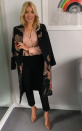 <p>Holly draped a floral jacquard-effect coat from <a rel="nofollow noopener" href="http://www.whistles.com/women/clothing/limited-collection/floral-jacquard-coat-26105.html?dwvar_floral-jacquard-coat-26105_size=04&utm_source=google_shopping&utm_medium=cpc&utm_term=.&utm_campaign=&utm_content=sy35Nh9RB_dc|pcrid||pkw||pmt||pid|26105_Pink%2FMulti_04|&gclid=EAIaIQobChMIkoyZ44ug1wIVZpPtCh1xRw5cEAQYASABEgLuzfD_BwE" target="_blank" data-ylk="slk:Whistles;elm:context_link;itc:0" class="link ">Whistles</a> over a silky shirt by Theory for one episode. She teamed the look with trousers from Whistles and nude <a rel="nofollow noopener" href="https://www.harrods.com/en-gb/gianvito-rossi/gianvito-pumps-105-p000000000005285805?colour=Brown&dco=GB&pcu=GBP&cid=Shopping_UK_GGL_Gianvito_Rossi_P000000000005285805_Brown_IT%2040&_cclid=v3_e1f4c38f-b9db-535a-b0ec-f467c78017f0&gclid=EAIaIQobChMI2PKQuIyg1wIV6rDtCh1zmgLnEAYYASABEgK79fD_BwE" target="_blank" data-ylk="slk:heels;elm:context_link;itc:0" class="link ">heels</a> by Gianvito Rossi. </p>