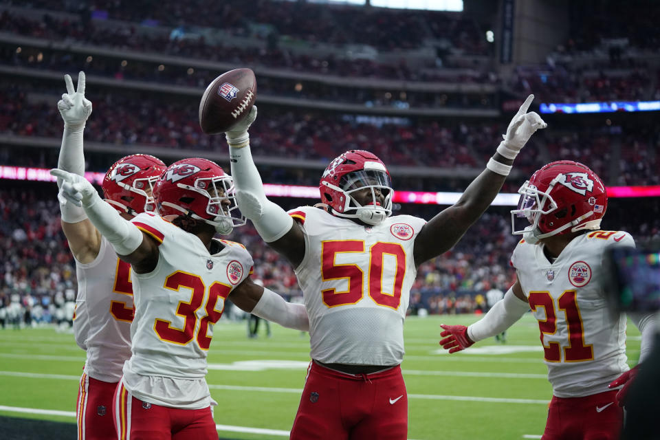 Kansas City Chiefs cornerback L'Jarius Sneed (38), linebacker Willie Gay (50) and cornerback Trent McDuffie (21) celebrate the team's overtime win over the Houston Texans in an NFL football game Sunday, Dec. 18, 2022, in Houston. (AP Photo/Eric Christian Smith)