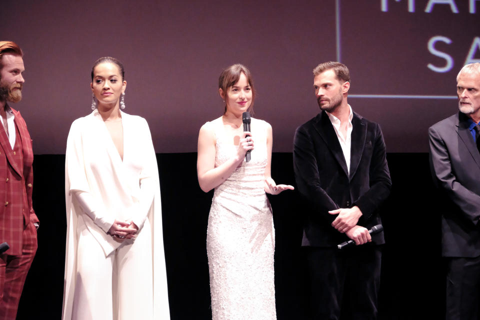 <p>Rita Ora, Jamie Dornan, and Dakota Johnson photographed for the Fifty Shade Freed Premiere on Feb 6, 2018 in Paris, France. (Photo by Olivier VIGERIE / Contour by Getty Images) </p>