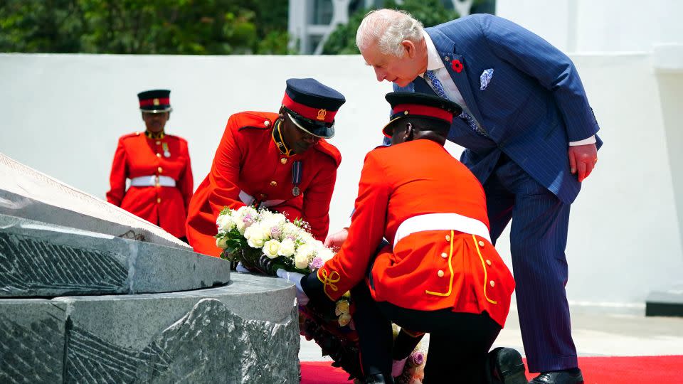 The British King, seen here laying a wreath at the Tomb of the Unknown Warrior, and Queen Camilla are visiting Kenya at Ruto's invitation to celebrate the relationship between the two countries. The visit comes as Kenya prepares to commemorate 60 years of independence from Britain. - Victoria Jones/Pool/Getty Images