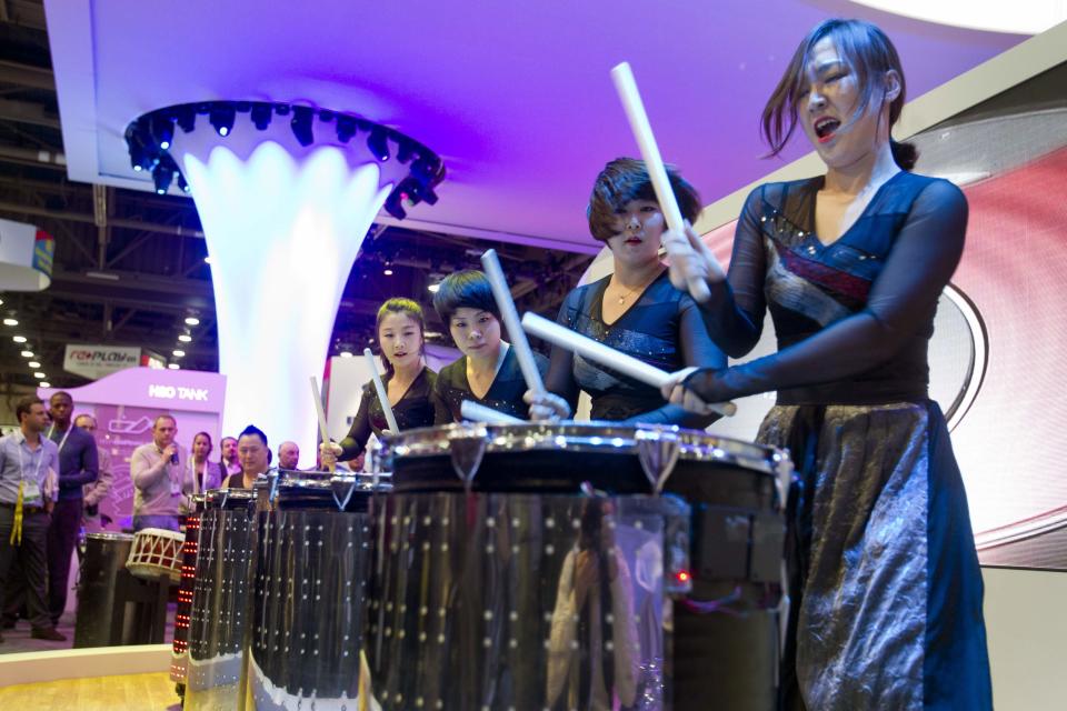 'Boom Boom", a Korean drum troupe performs at the Moneual booth during the 2014 International Consumer Electronics Show (CES) in Las Vegas