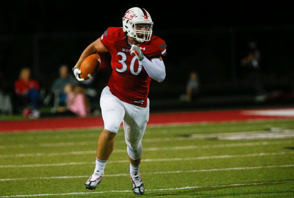 Reeds Spring senior Caden Wiest carries the ball during a game against the Logan-Rogersville Wildcats at Reeds Spring on Friday, Oct. 14, 2022.