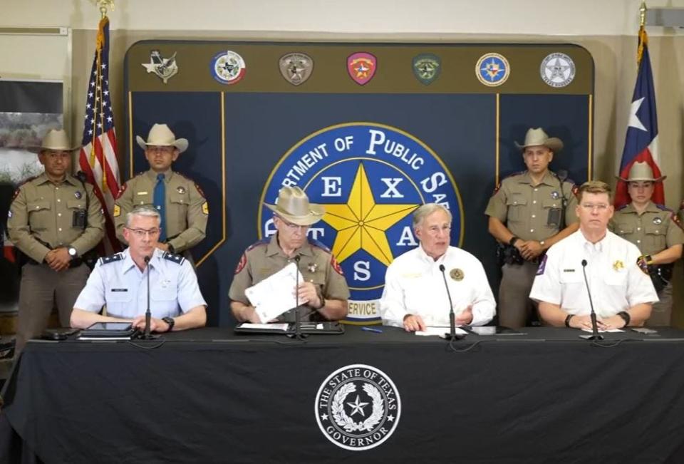 Gov. Greg Abbott, third from left, speaks at a border security news conference in Weslaco on April 6, 2022. With him on the front row are National Guard Maj. Gen. Thomas Suelzer, Department of Public Safety Director Steve McCraw and Texas Division of Emergency Management Chief Nim Kidd at the far right.