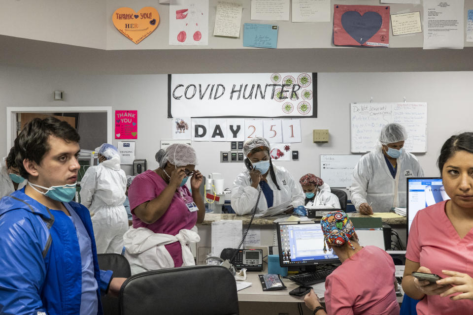 Staff in the nursing station as the numbers on the wall indicate the days since the hospital opened its Covid-19 ICU at the United Memorial Medical Center in Houston, Texas. Source:  Getty