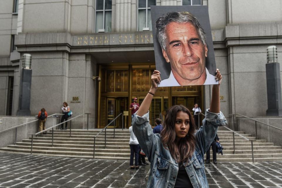 <div class="inline-image__title">1154615743</div> <div class="inline-image__caption"><p>A protest group called \"Hot Mess\" hold up signs of Jeffrey Epstein in front of the federal courthouse.</p></div> <div class="inline-image__credit">Stephanie Keith / Getty</div>