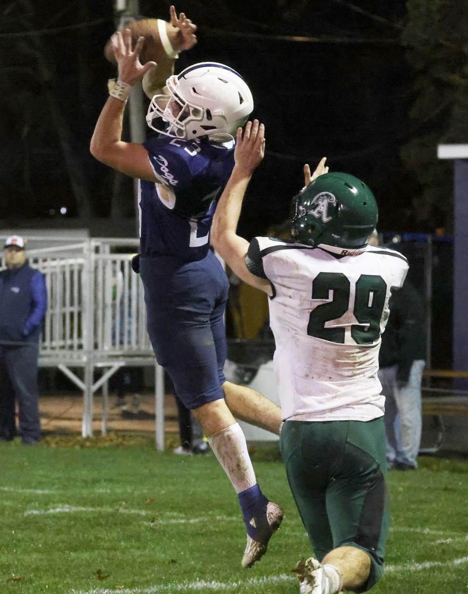 Rockland's Lucas Leander makes the touchdown catch on Abington's AJ Nash during a game on Friday, Nov. 11, 2022.