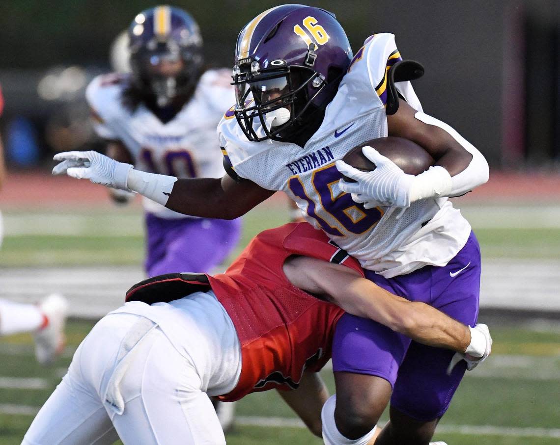 Everman’s Kayden Brooks, top, is tackled by Burleson’s Cayden Cartmill after a catch and run for a first down in the first quarter of Thursday’s October 13, 2022 District 5-5A Division 2 football game at Burleson ISD Stadium in Burleson, Texas. Special/Bob Haynes