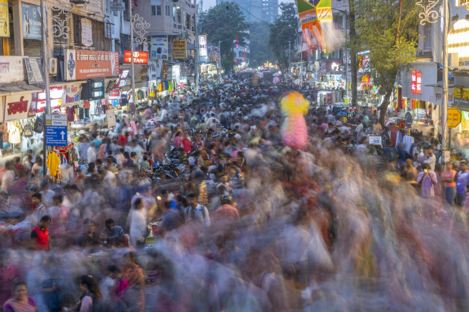 People crowd a market as they shop ahead of Diwali festival in Mumbai, India, Sunday, Nov. 5, 2023. (AP Photo/Rafiq Maqbool)