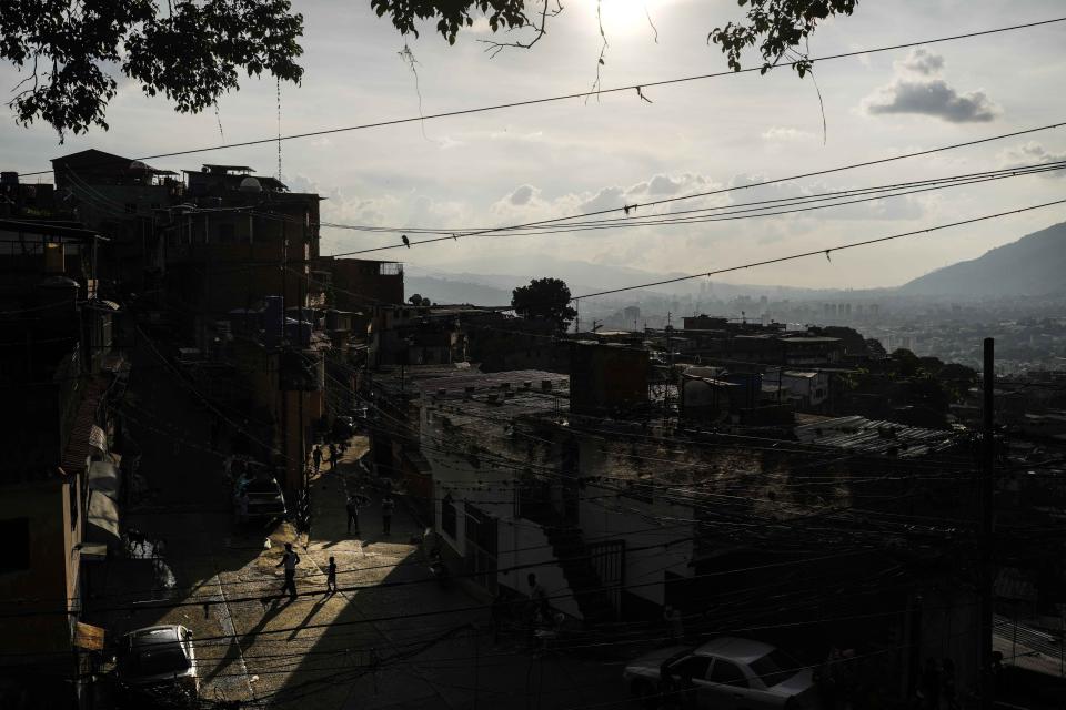 FILE - People walk through the low-income Petare neighborhood of Caracas, Venezuela, Sept. 17, 2023. (AP Photo/Matias Delacroix, File)