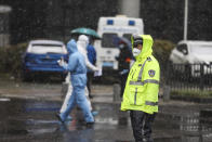 A policeman directs traffic outside a tumor hospital newly designated to treat COVID-19 patients in Wuhan in central China's Hubei Province, Saturday, Feb. 15, 2020. The virus is thought to have infected more than 67,000 people globally and has killed at least 1,526 people, the vast majority in China, as the Chinese government announced new anti-disease measures while businesses reopen following sweeping controls that have idled much of the economy. (Chinatopix via AP)