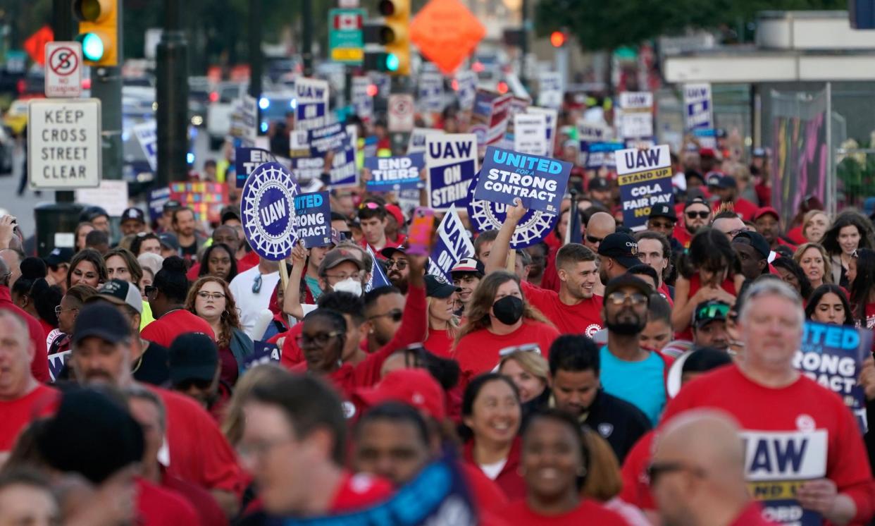 <span>United Auto Workers members march through downtown Detroit in September 2023.</span><span>Photograph: Paul Sancya/AP</span>