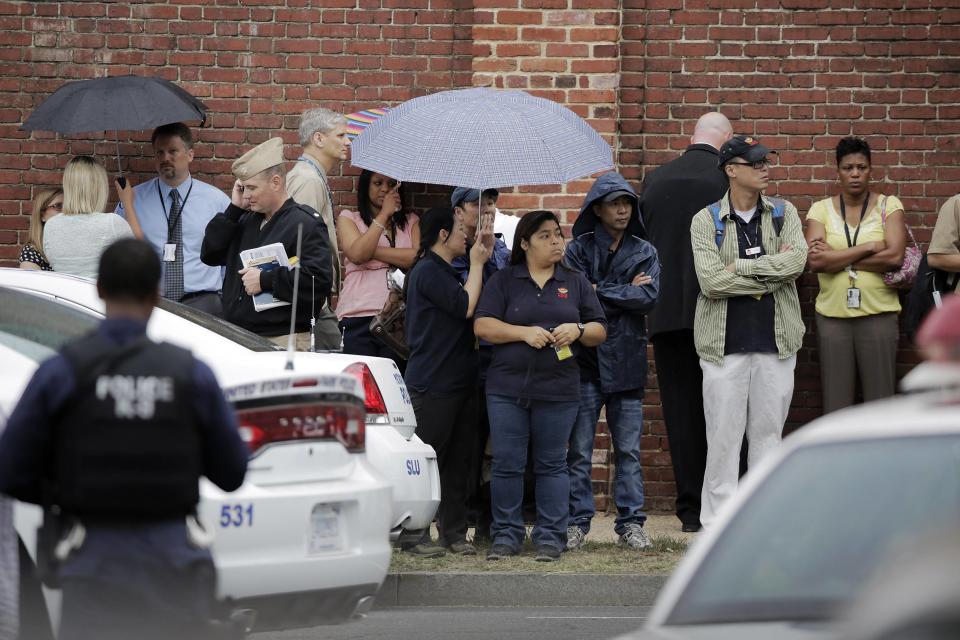 Washington Navy Yard personnel are evacuated after a gunman reportedly shot several people inside the base in Washington, September 16, 2013. (REUTERS/Jason Reed)