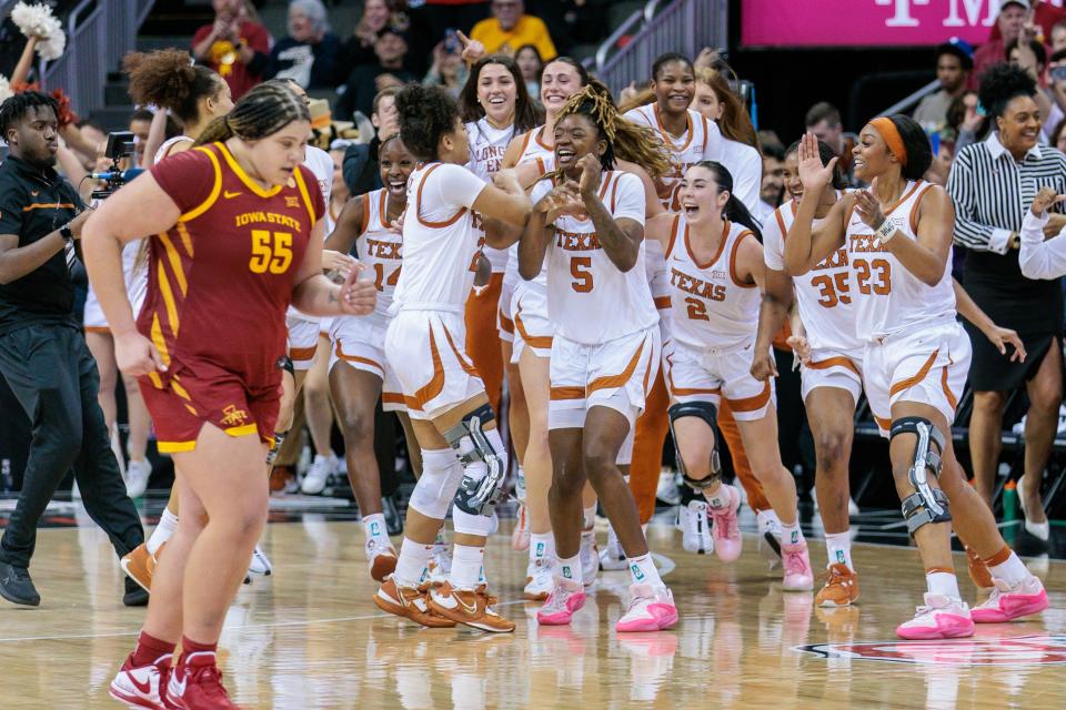 Texas players celebrate Tuesday night's 70-53 win over Iowa State in the Big 12 Tournament championship game. The Longhorns are one of three 30-win teams in the country and are hoping to secure a No. 1 seed in the NCAA Tournament.