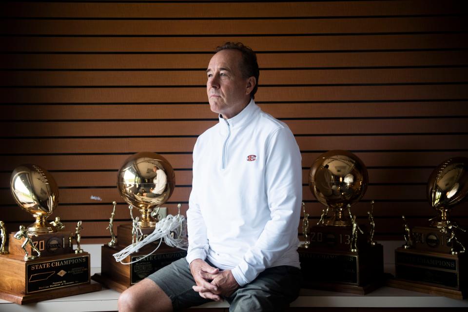 Ricky Bowers, Ensworth AD, the recipient of the Fred Russell Lifetime Achievement Award as given by The Tennessean, sits among his 9 different trophies at Ensworth High School in Nashville , Tenn., Thursday, June 1, 2023.