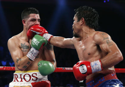 Manny Pacquiao lands a right to Brandon Rios during their WBO international welterweight title fight last year. (AP)