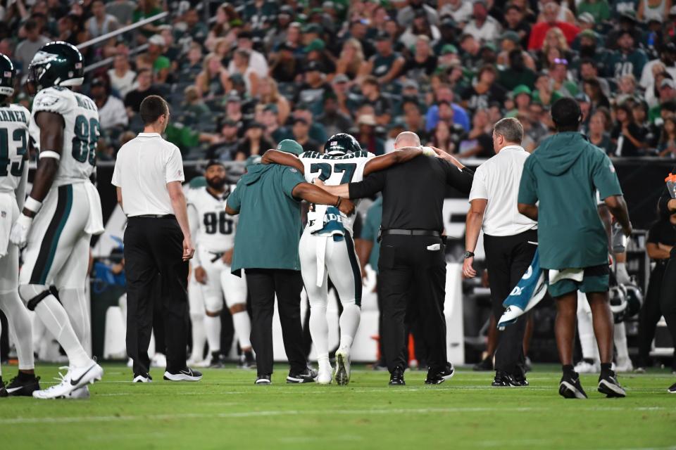 Aug 17, 2023; Philadelphia, Pennsylvania, USA; Philadelphia Eagles cornerback Zech McPhearson (27) is helped off the field with an injury against the Cleveland Browns during the second quarter at Lincoln Financial Field. Mandatory Credit: Eric Hartline-USA TODAY Sports