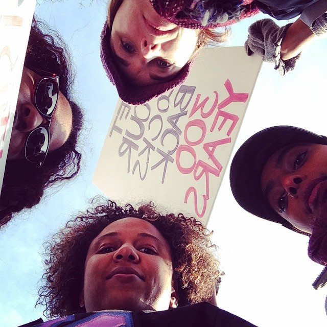 Protestors pose for a photo in Freedom Plaza in Washington, DC on Saturday, Dec. 13, 2014. 