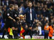 Britain Soccer Football - Tottenham Hotspur v Stoke City - Premier League - White Hart Lane - 26/2/17 Tottenham's Harry Kane takes the match ball from referee Jonathan Moss at the end of the match after completing a hat trick Action Images via Reuters / Peter Cziborra Livepic