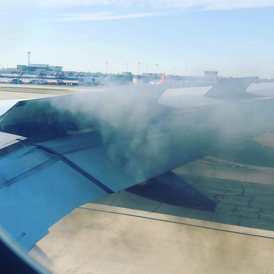 Smoke billows from an engine of the Delta Air Lines plane (REUTERS)