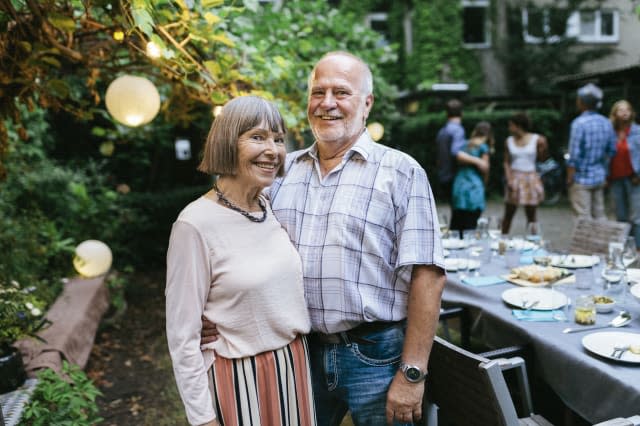 Portrait Of Elderly Couple At Family BBQ