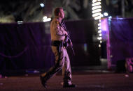 <p>Las Vegas police patrol along the streets outside the the Route 91 Harvest country music festival grounds after a active shooter was reported on Oct. 1, 2017 in Las Vegas, Nevada. (Photo: David Becker/Getty Images) </p>