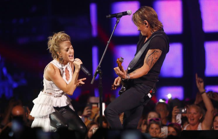 Carrie Underwood, left, and Keith Urban perform 