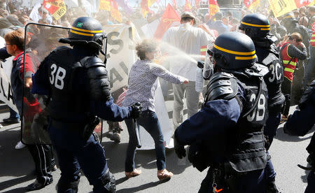 Demonstrators face off with French CRS riot police as they attend a national strike and protest against the government's labour reforms in Lyon, France, September 12, 2017. REUTERS/Robert Pratta