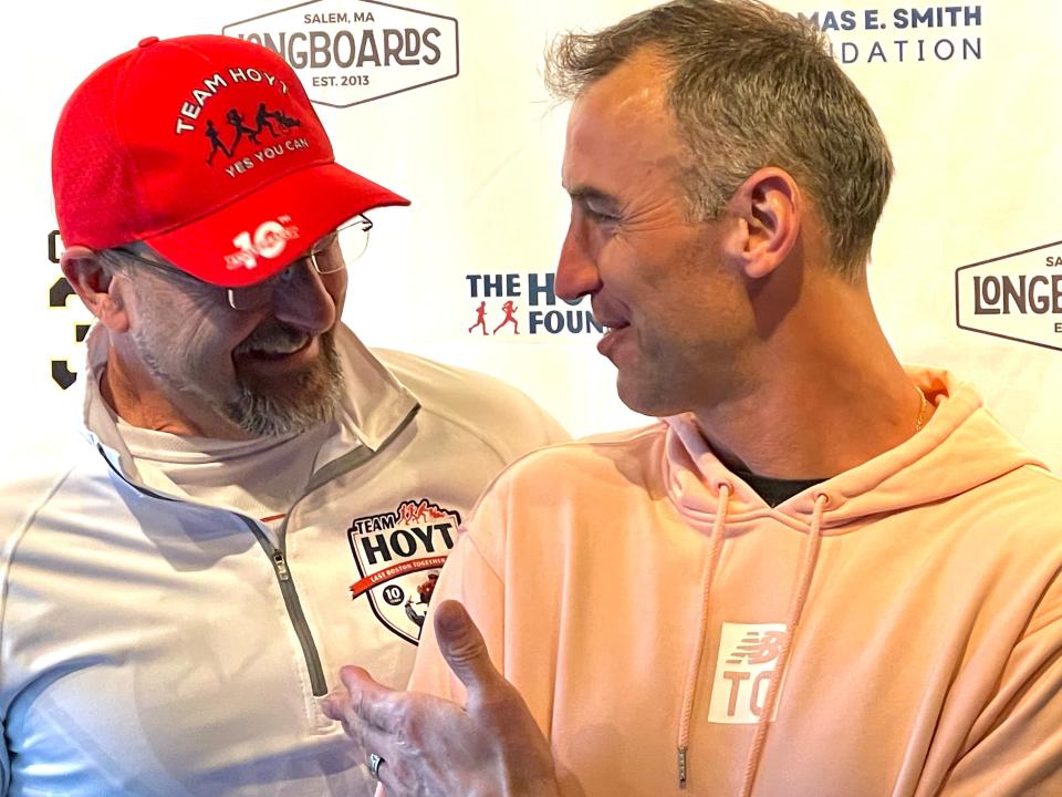 Former Boston Bruins captain Zdeno Chara, right, speaks with Russ Hoyt at a Boston Bruins watch party in Salem on March 23, 2024.