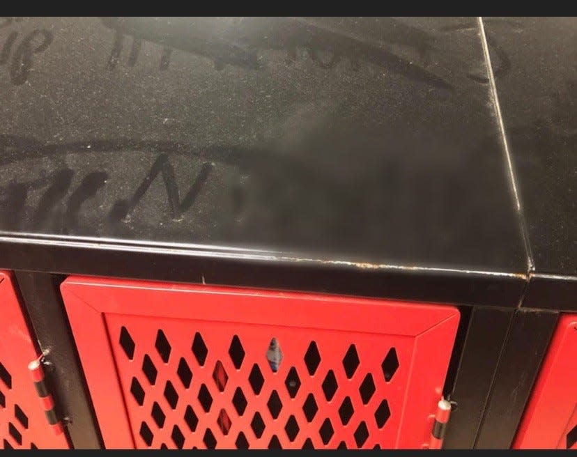 Pictures taken by Beloit Memorial High School basketball players show a racial slur written in the dust in the Muskego High School locker room.
(Photo: Submitted)