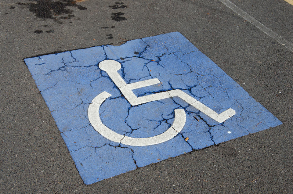 Pictured is a wheelchair disabled symbol in a car park. 