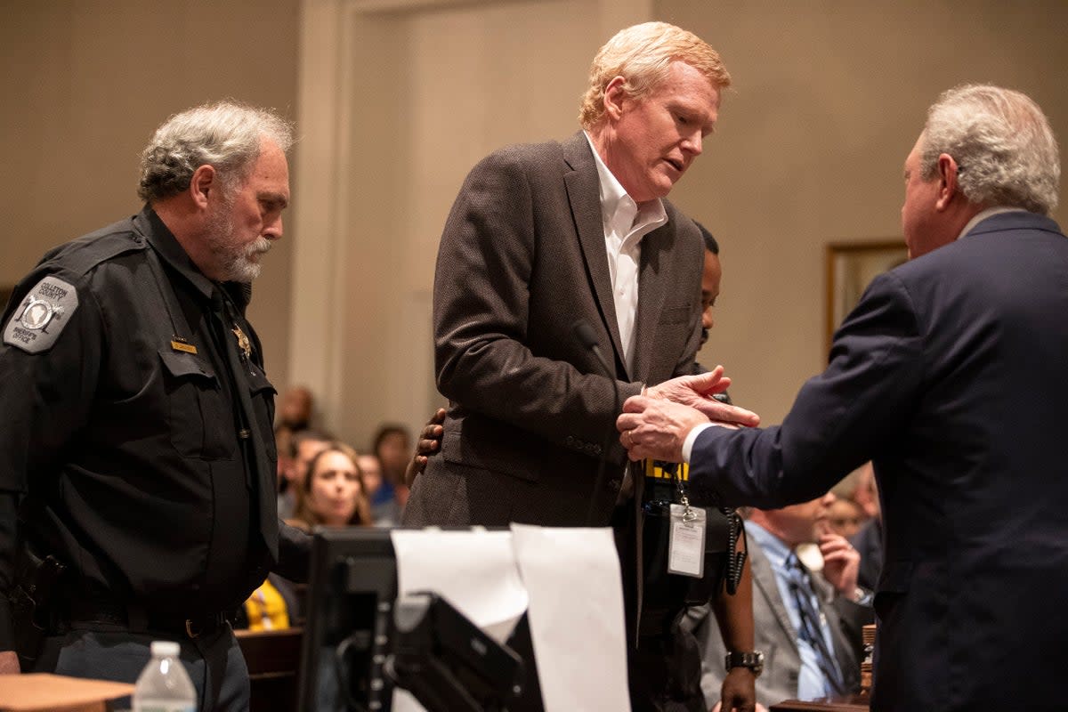 Alex Murdaugh, centre, is handcuffed in the courtroom after a guilty verdict of his double murder trial was read aloud at Colleton County Courthouse in Walterboro, South Carolina (AP)