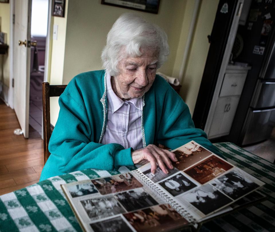 Ann Nehrbauer, 95, of Hastings-on-Hudson, looks at photos of her Stephen April 4, 2024. Stephen, who was developmentally disabled and died at the age of 67 in 2023, was a resident of the Willowbrook State School in the 1970Õs. Ann was among those who brought a civil rights lawsuit against the institution. The lawsuit called attention to the poor living conditions at Willowbrook. She is being honored by Arc Westchester Foundation with their Lifetime Advocate Award.