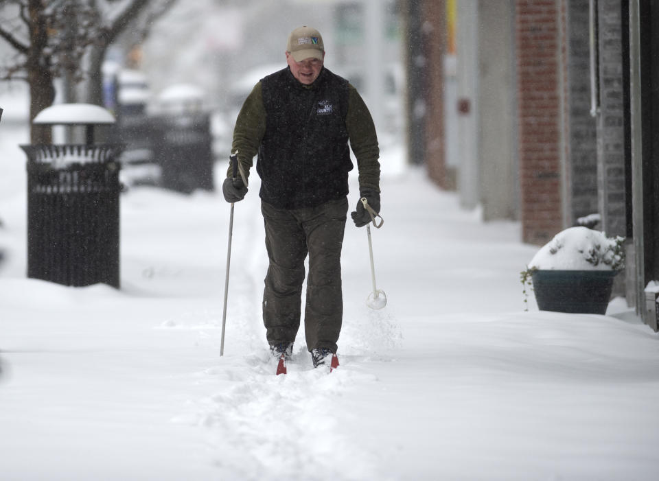 Brian Hill from Squirrel Hill skis along Forbes Avenue Monday, Jan. 17, 2022, in Squirrel Hill neighborhood of Pittsburgh. (Pam Panchak/Pittsburgh Post-Gazette via AP)