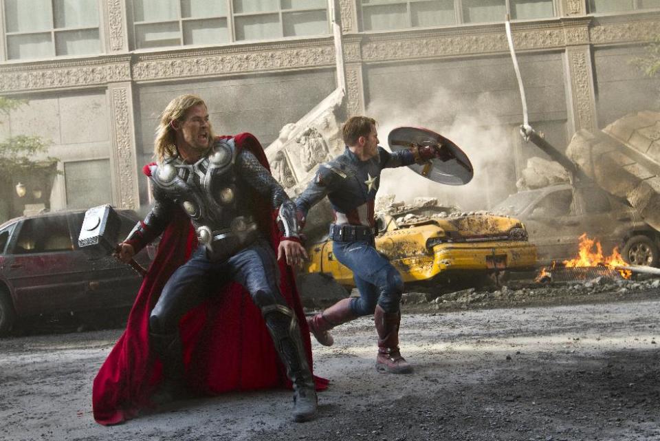 FILE - In this film publicity image released by Disney, Chris Hemsworth portrays Thor, left, and and Chris Evans portrays Captain America in a scene from "The Avengers." The superhero blockbusters “The Avengers,” “The Dark Knight Rises” and “The Amazing Spider-Man” are among 10 films that have made the cut for visual-effects nominations for the Feb. 24 Oscars. The other seven contenders announced Thursday, Nov. 29, 2012, are the Bond adventure “Skyfall,” “Snow White and the Huntsman,” “The Hobbit: An Unexpected Journey,” “Cloud Atlas,” “John Carter,” “Life of Pi” and “Prometheus.” (AP Photo/Disney, Zade Rosenthal, File)