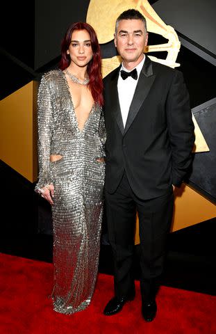 <p>Lester Cohen/Getty</p> Dua Lipa with her dad, Dukagjin Lipa at the Grammy Awards