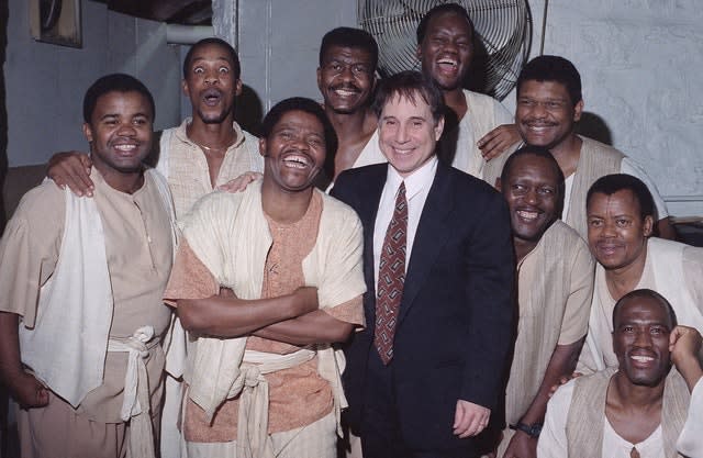 Joseph Shabalala, front left, founder of South Africa’s Ladysmith Black Mambazo, with the group and Paul Simon, front right